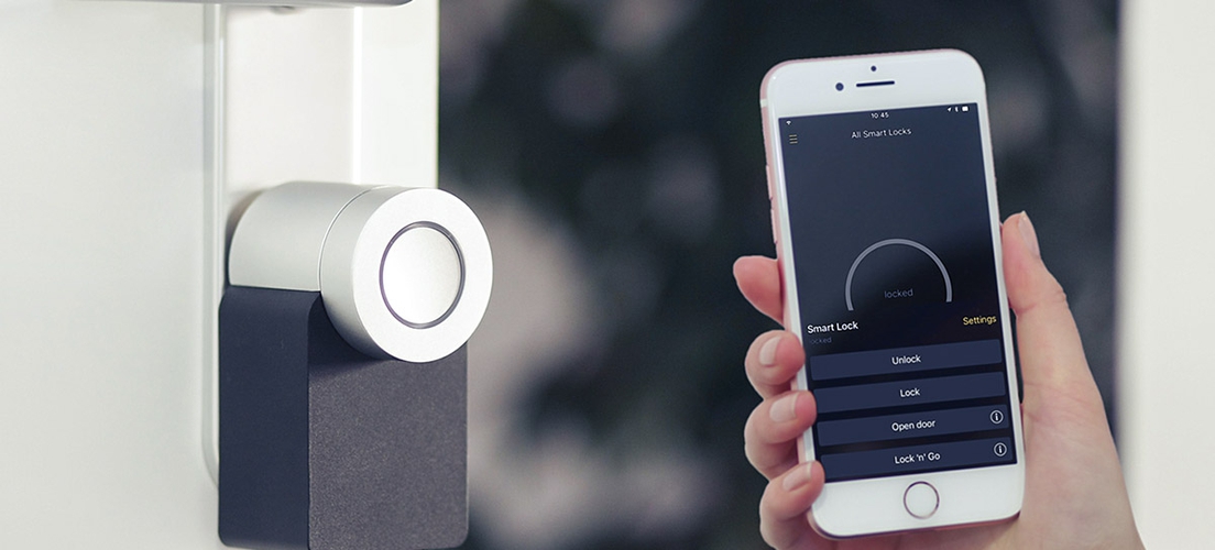A smartphone held near a smart lock.
