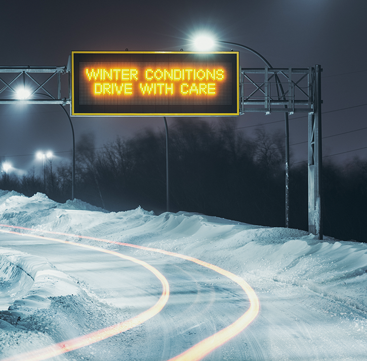 An LED display that visualizes the road sign “Winter Conditions. Drive with Care”.
