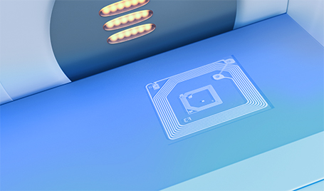 An RFID tag attached to a surface.