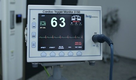 A cardiac trigger monitor connected to sensors.