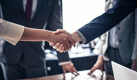Two people shaking hands.