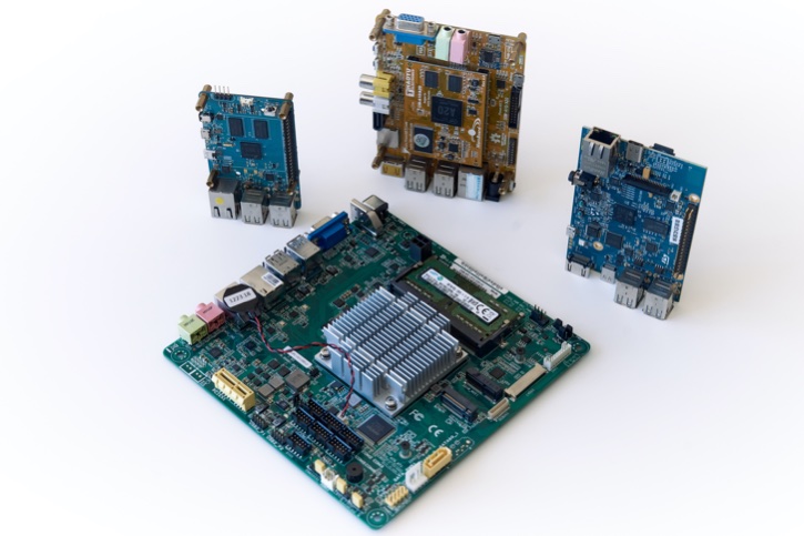 Four single-board computers including Raspberry Pi and Intel board.