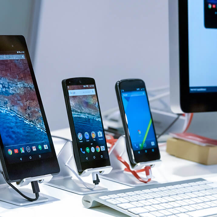 Three Android smartphones are charging