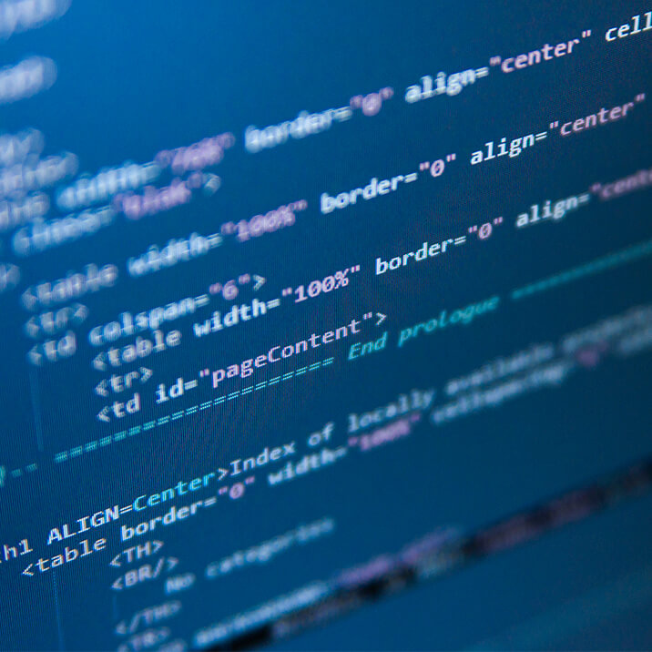 A computer monitor with pieces of code on the screen