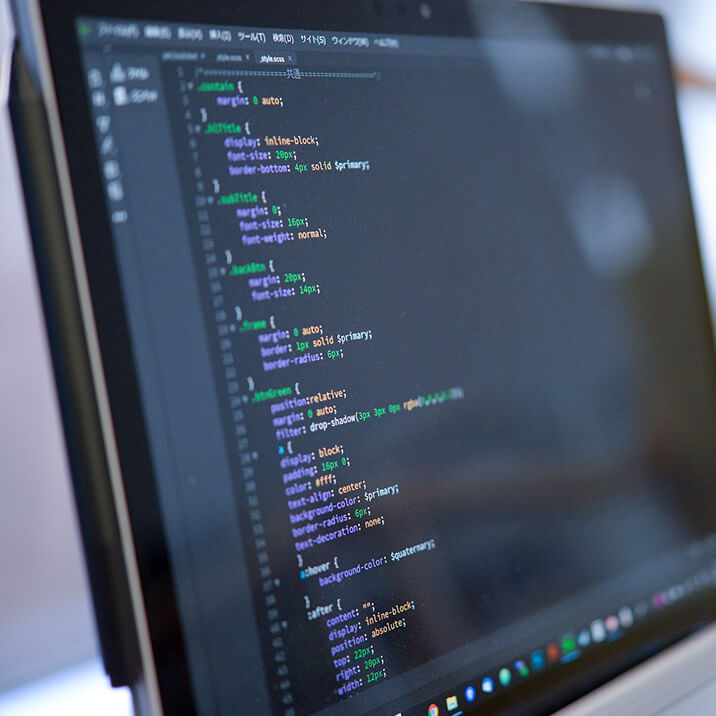Programming code on the screen of a laptop.