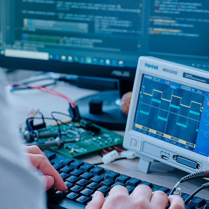 Integra's engineer testing an electronic device and its software
